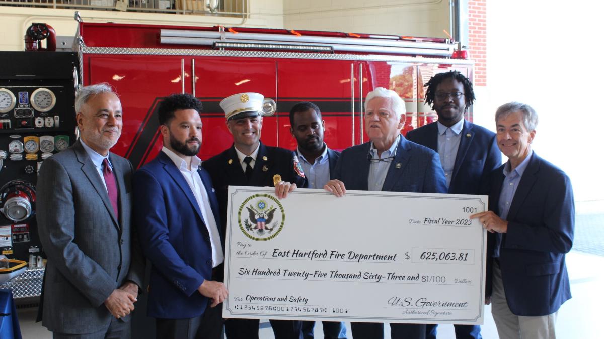 State Senator Saud Anwar, East Hartford Mayor Connor Martin, Fire Chief Kevin Munson, Rep. Larson, and Councilmembers Awet Tsegai, Don Bell, and Richard Kehoe