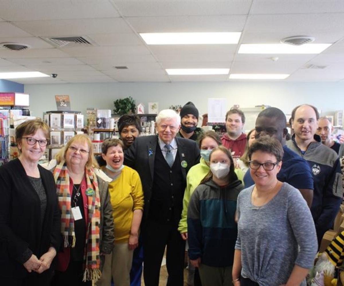 Rep. Larson and Rep. Garibay with the staff of the Blue Dragonfly gift shop in Windsor