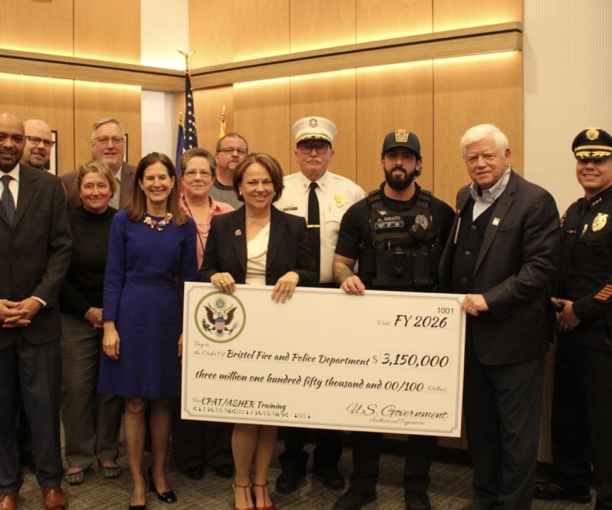 Lt. Governor Susan Bysiewicz, State Rep. Mary Fortier, Bristol Fire Chief Richard Hart, Officer Alec Iurato, Rep. Larson, Chief of Police Mark Morello, and members of the Bristol City Council