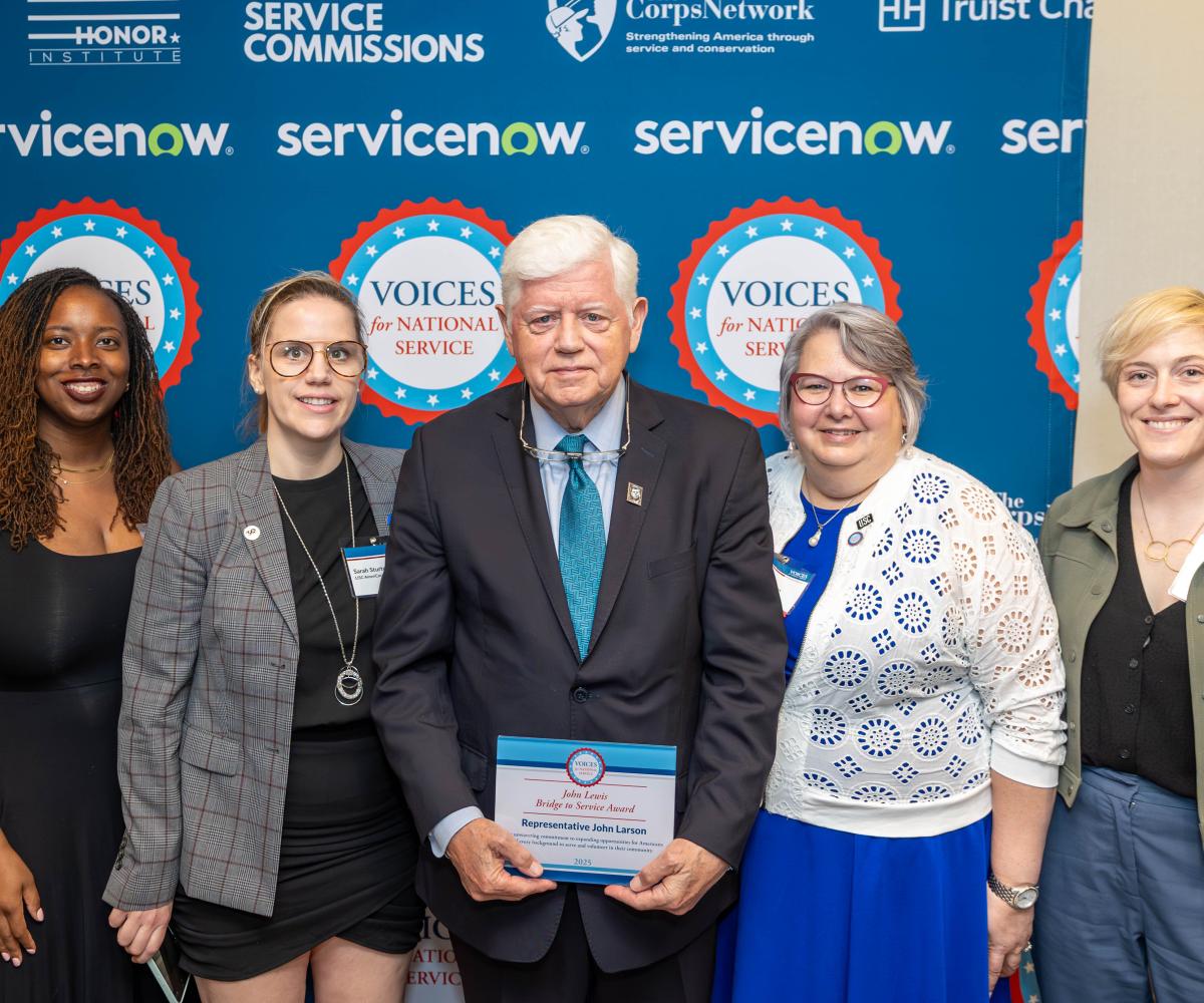Rep. Larson receives the John Lewis Bridge to Service Award with Connecticut AmeriCorps volunteers and staff 