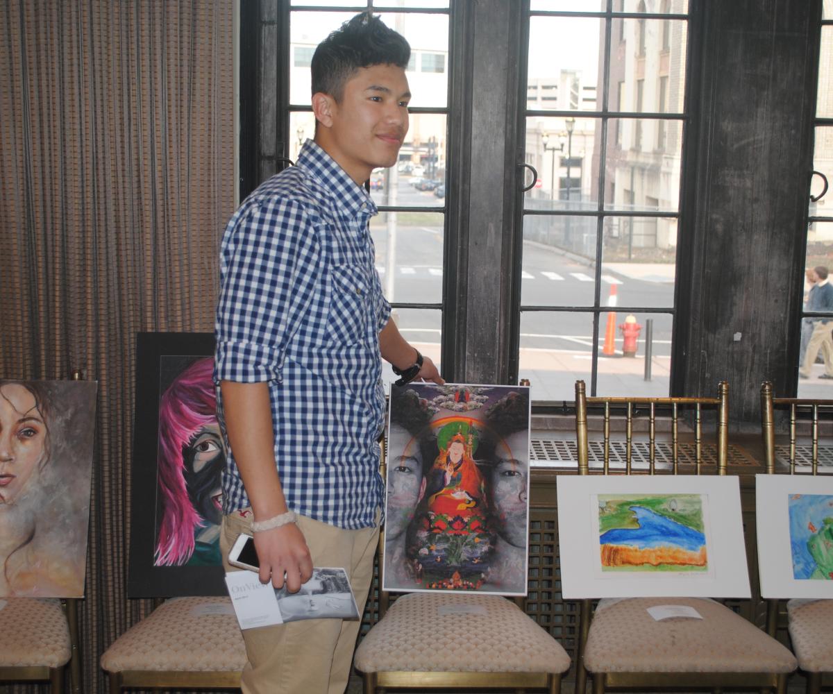 Jensun Yonjan stands with his winning piece, "Evanescent"