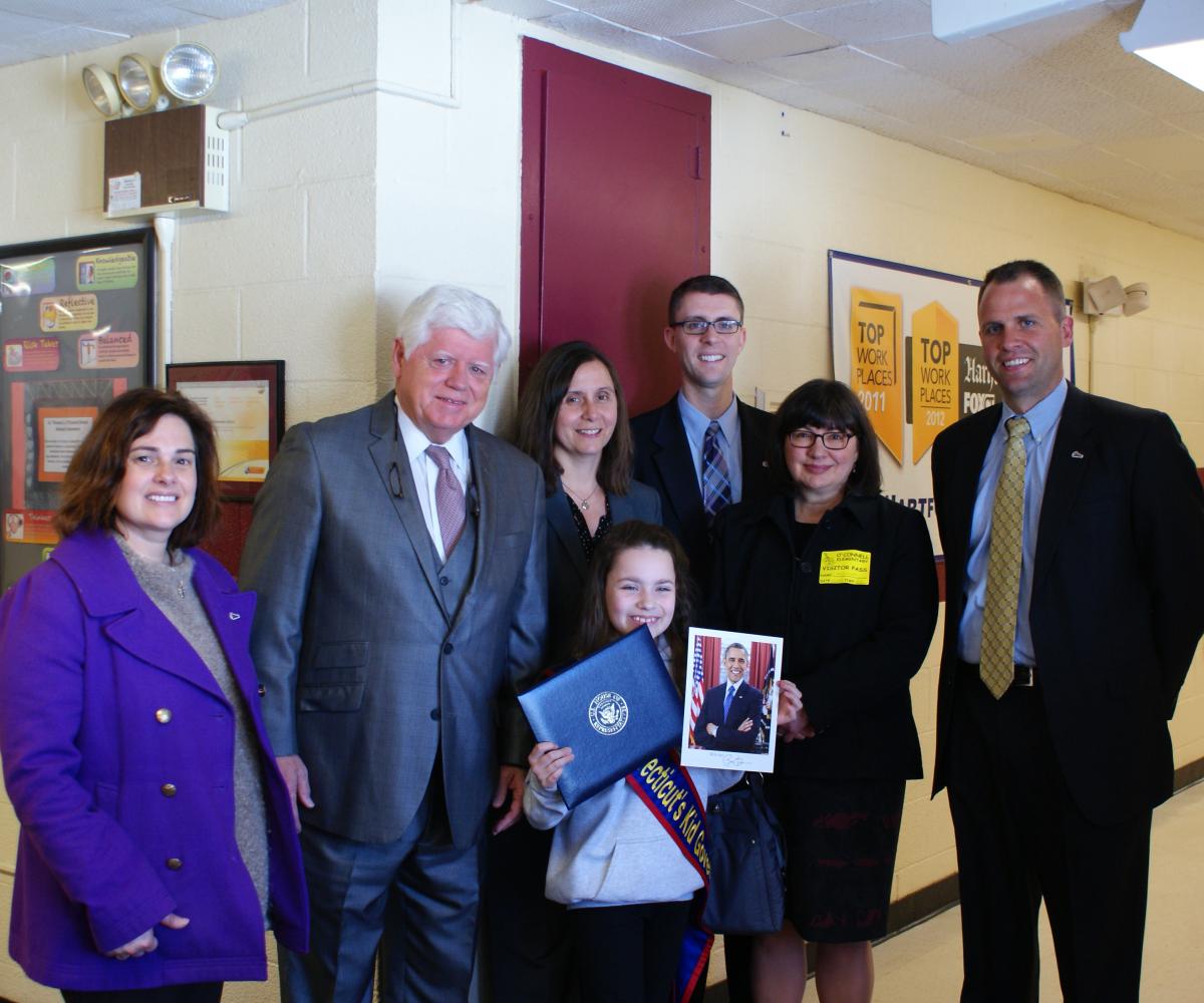 Rep. Larson presents Elena Tipton with a Congressional citation and a letter from President Obama.