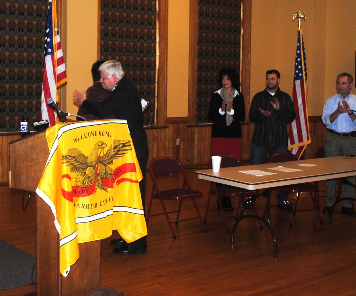 Larson thanks Matthew "Mack" McDonald for his service