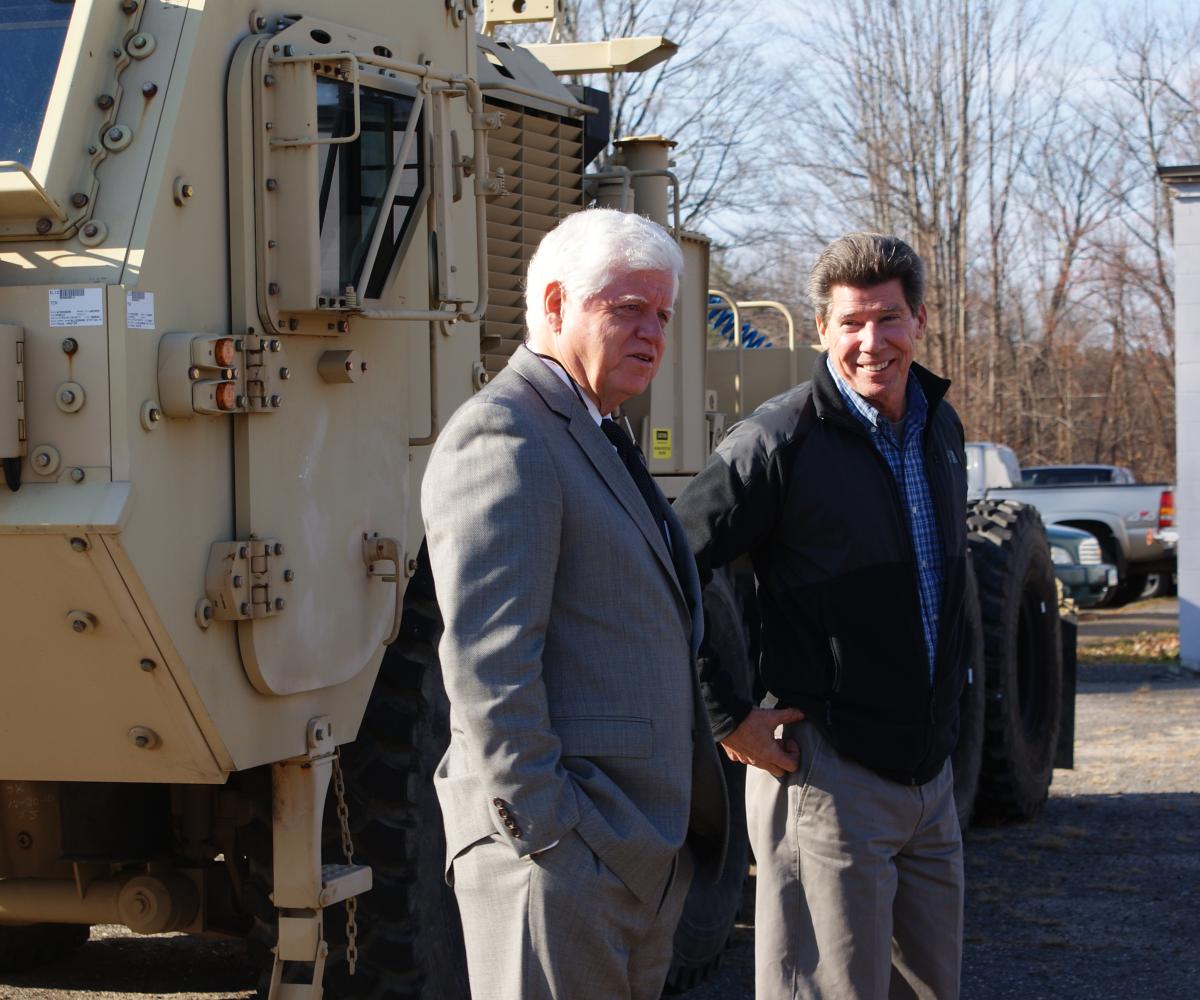 Rep. Larson speaks with President Marty Marola at Tru-Hitch, Inc.