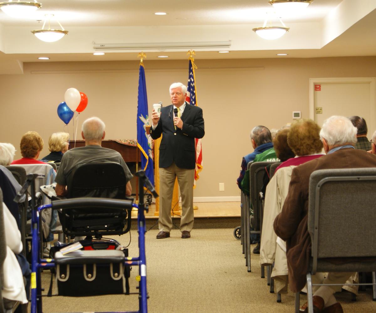 Rep. Larson addresses seniors in Manchester.