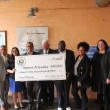 International Hartford Executive Director Art Feltman, Village President & CEO Hector Glynn, Capitol Squash Deputy Director Lindsay Behling, Hartford City Councilman Amilcar Hernandez, Rep. Larson, International Hartford Financial Literacy Project Director Erwin T. Hurst, and Hispanic Federation staff
