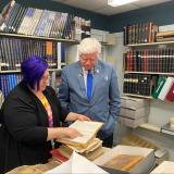 Larson looks at library archives with Reference Librarian Lynn Gardner