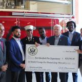 State Senator Saud Anwar, East Hartford Mayor Connor Martin, Fire Chief Kevin Munson, Rep. Larson, and Councilmembers Awet Tsegai, Don Bell, and Richard Kehoe