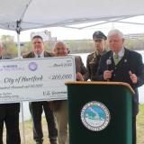 East Hartford Mayor Mike Walsh, East Hartford Town Engineer Douglas Wilson, Hartford City Engineer and Assistant Director of Public Works Frank Dellaripa, Lt. Colonel Michael Carvelli of the U.S. Army Corps of Engineers, and Rep. Larson in front of the Connecticut River