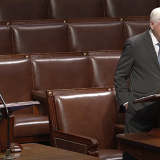 Reps. Melanie Stansbury and John Larson on the House floor