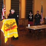 Larson thanks Matthew "Mack" McDonald for his service