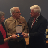 Rep. Larson presents Corporal Anthony “Tony” Zacchio and his wife Carol with the Korean Ambassador for Peace Medal.