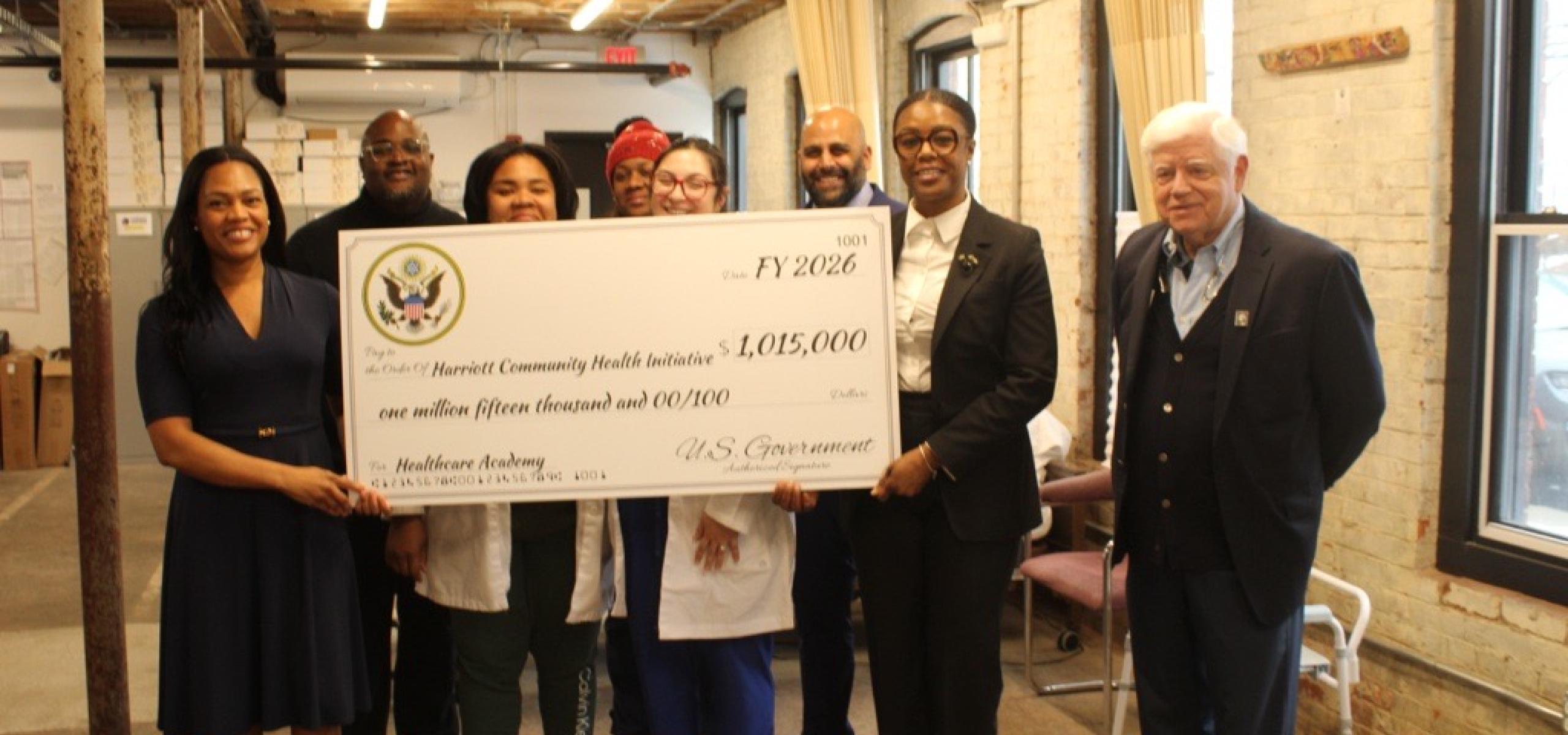 Rep. Larson and Hartford Mayor Arunan Arulampalam with Sasa Harriott and students at the Harriott Community Healthcare Academy in Blue Hills