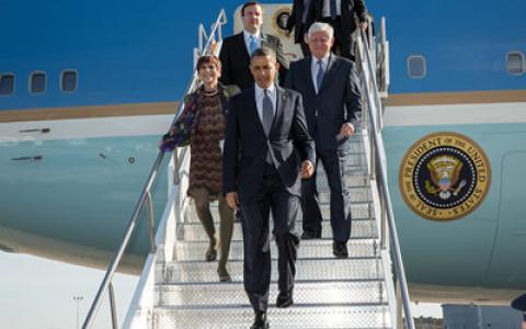 Larson exits Air Force One with President Barack Obama