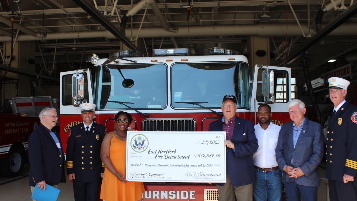State Rep. Henry Genga, East Hartford Fire Chief Kevin Munson, Councilwoman Sebrina Wilson, Mayor Mike Walsh, Councilman Awet Tsegai, Rep. Larson, and Assistant Fire Chief Stephen Alsup