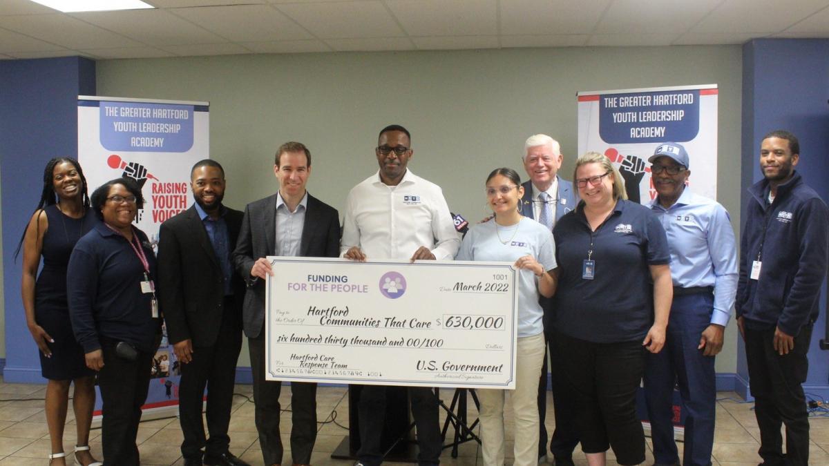 Hartford Mayor Luke Bronin, Hartford Communities That Care Executive Director Andrew Woods, and Rep. Larson