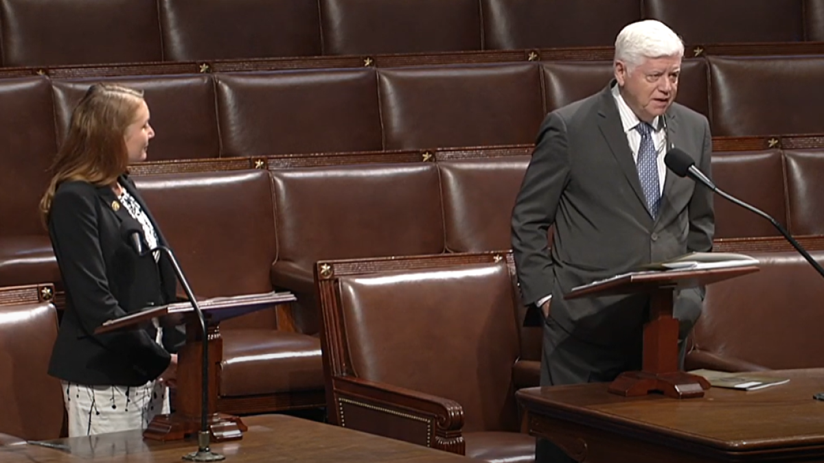Reps. Melanie Stansbury and John Larson on the House floor