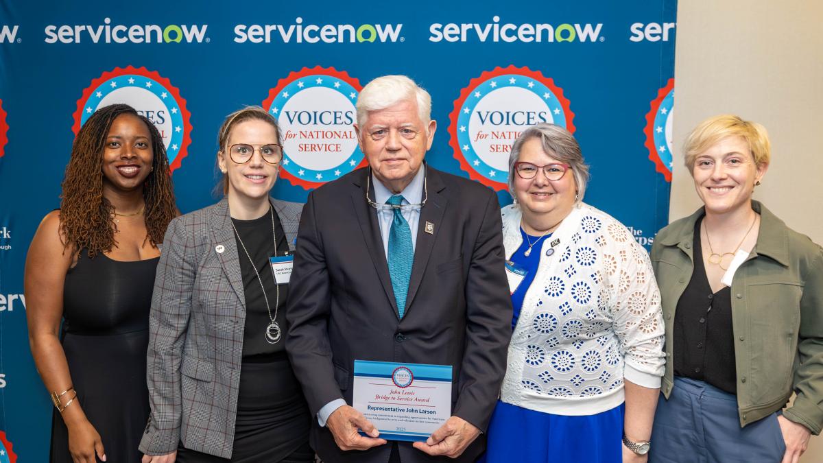 Rep. Larson receives the John Lewis Bridge to Service Award with Connecticut AmeriCorps volunteers and staff 