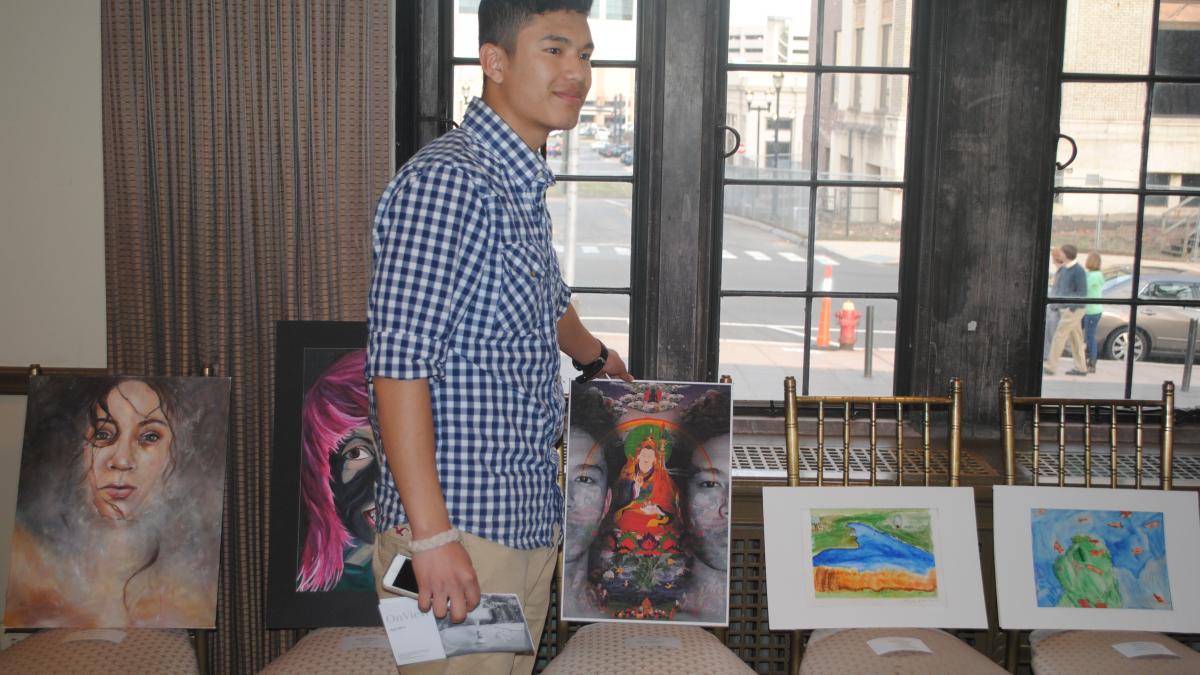 Jensun Yonjan stands with his winning piece, "Evanescent"