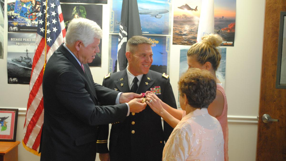 Rep. Larson presents Patrick Nelligan with medals