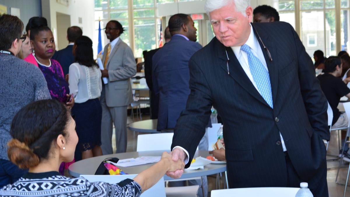Rep. Larson speaks with constituents at the announcement of the Promise Zone YES grant