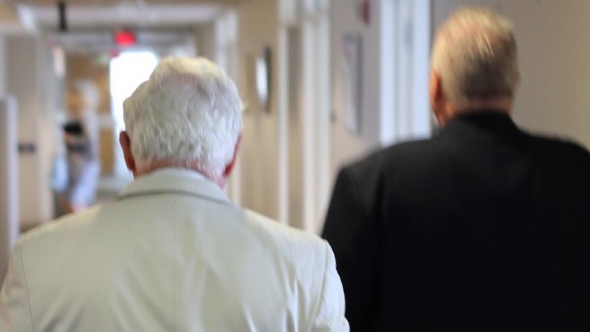 People walking down a hall