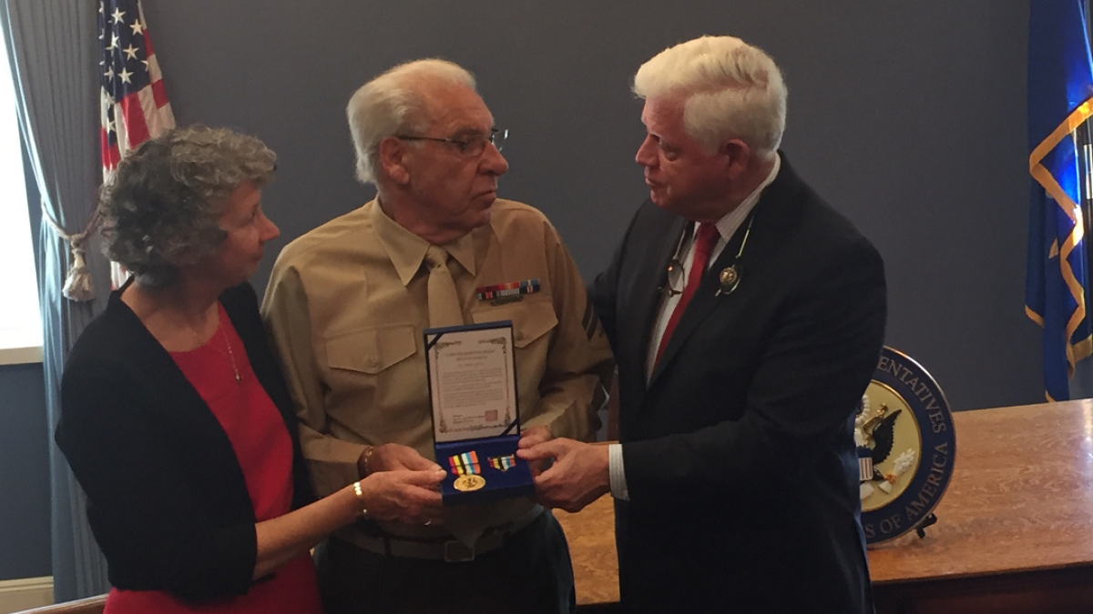 Rep. Larson presents Corporal Anthony “Tony” Zacchio and his wife Carol with the Korean Ambassador for Peace Medal.