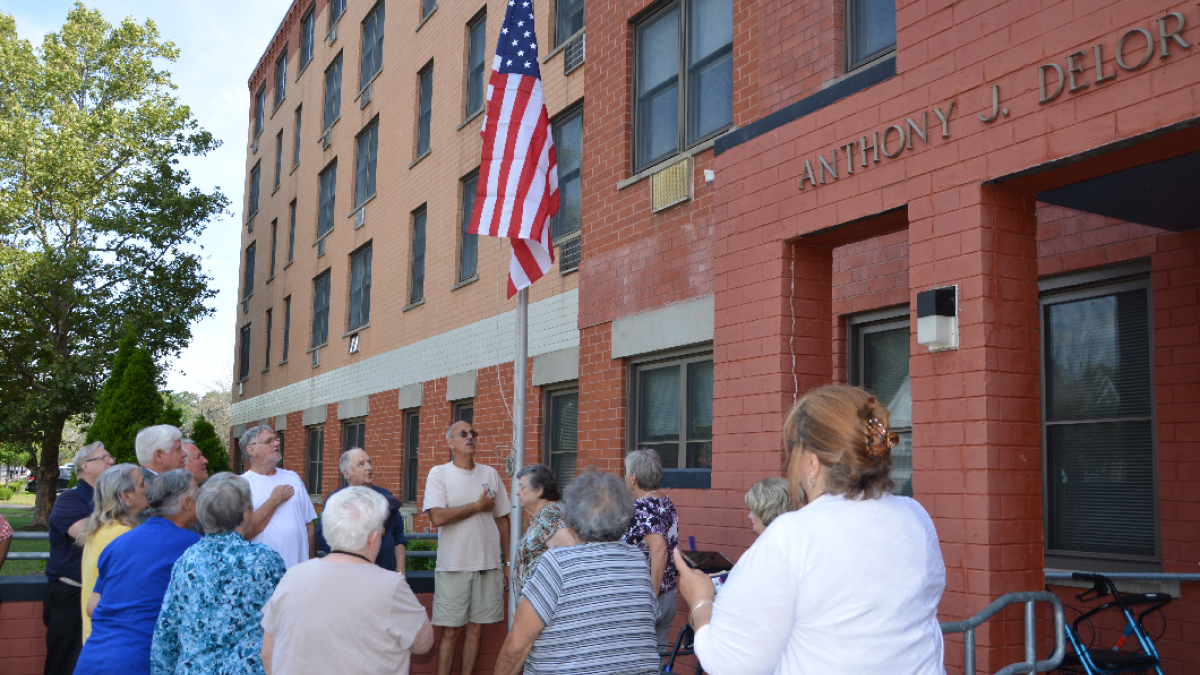 Rep. Larson leads residents in the Pledge of Allegiance.