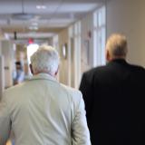 People walking down a hall