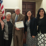 Rep. Larson receives his award from NETWORK.