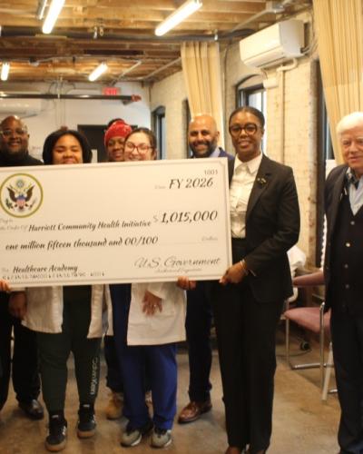 Rep. Larson and Hartford Mayor Arunan Arulampalam with Sasa Harriott and students at the Harriott Community Healthcare Academy in Blue Hills